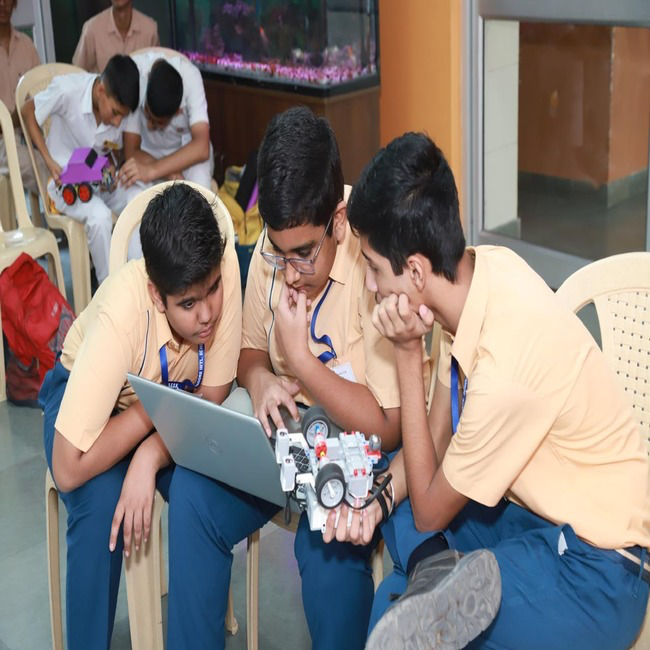 Students building a robotics prototype