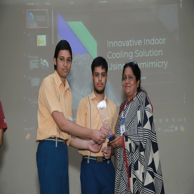 Students receiving trophy at INNONATION